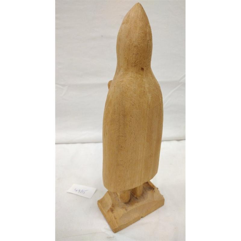 WOOD CARVING OF A FIGURE WEARING A PONCHO