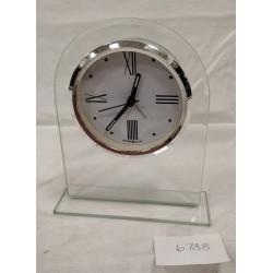 HOWARD MILLER QUARTZ CLOCK IN PLEXIGLAS STAND