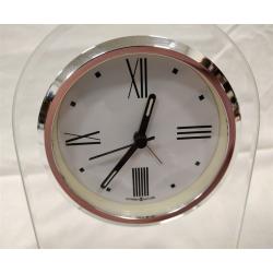 HOWARD MILLER QUARTZ CLOCK IN PLEXIGLAS STAND