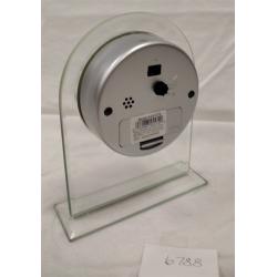 HOWARD MILLER QUARTZ CLOCK IN PLEXIGLAS STAND