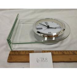 HOWARD MILLER QUARTZ CLOCK IN PLEXIGLAS STAND
