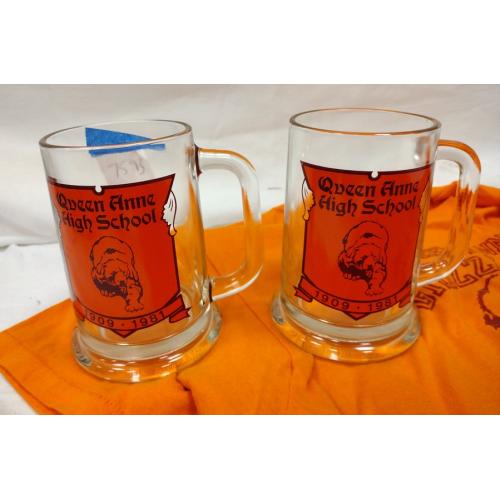 TWO QUEEN ANNE HIGH SCHOOL GLASS STEINS, ONE TEE SHIRT