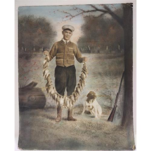 1920s LARGE COLOR PHOTO OF A YOUNG HUNTER WITH A STRING OF DEAD BIRDS