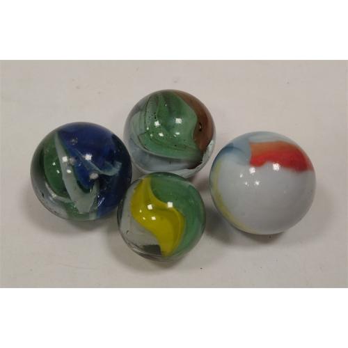 FOUR VINTAGE SHOOTER MARBLES