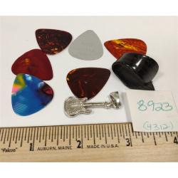 SEVEN VINTAGE GUITAR PICKS AND RHINESTONE GUITAR PENDANT