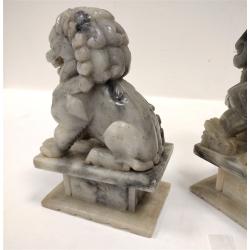 PAIR OF ANTIQUE STONE FOO LIONS WITH WOOD STANDS, one broken