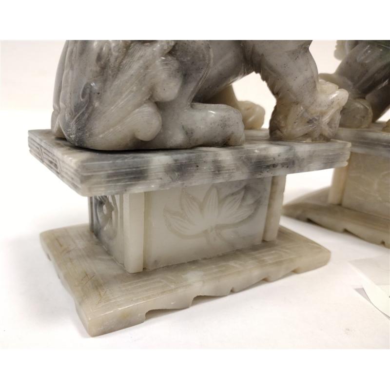 PAIR OF ANTIQUE STONE FOO LIONS WITH WOOD STANDS, one broken