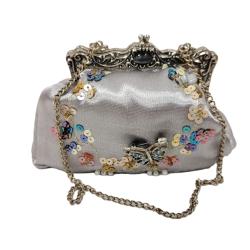 PUTTING ON THE RITZ MINI JEWELED AND SEQUINED HANDBAG