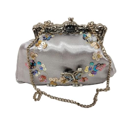 PUTTING ON THE RITZ MINI JEWELED AND SEQUINED HANDBAG
