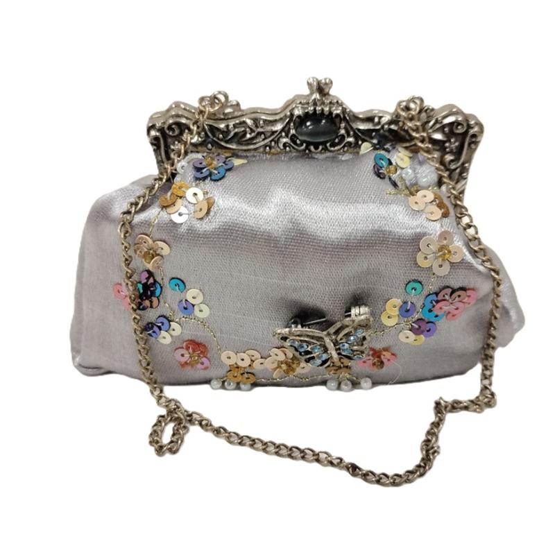 PUTTING ON THE RITZ MINI JEWELED AND SEQUINED HANDBAG