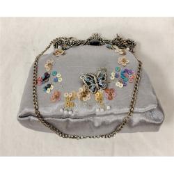 PUTTING ON THE RITZ MINI JEWELED AND SEQUINED HANDBAG