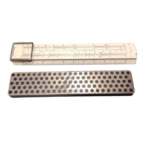 SMALL SLIDE RULE AND A SHARPENER