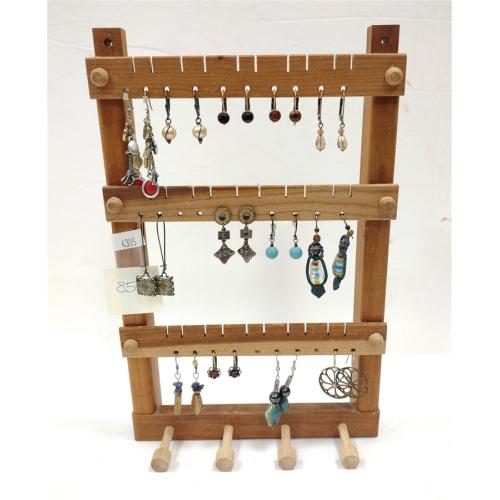 THIRTEEN PAIRS OF EARRINGS AND WOODEN HOLDER